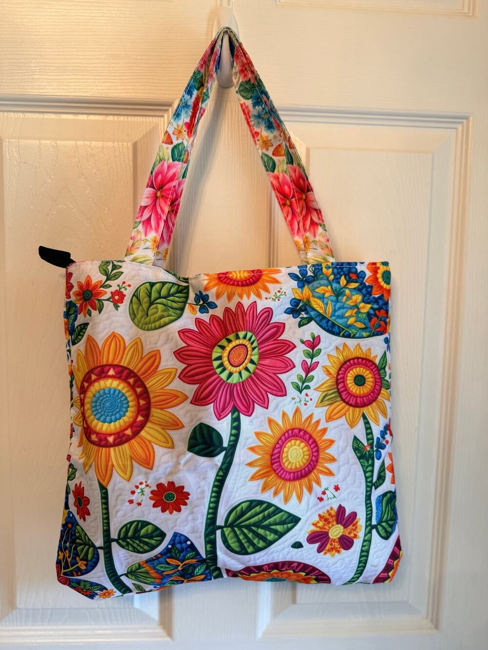 New Tote bag features a vibrant vibrant, multi-colored floral pattern sunflowers